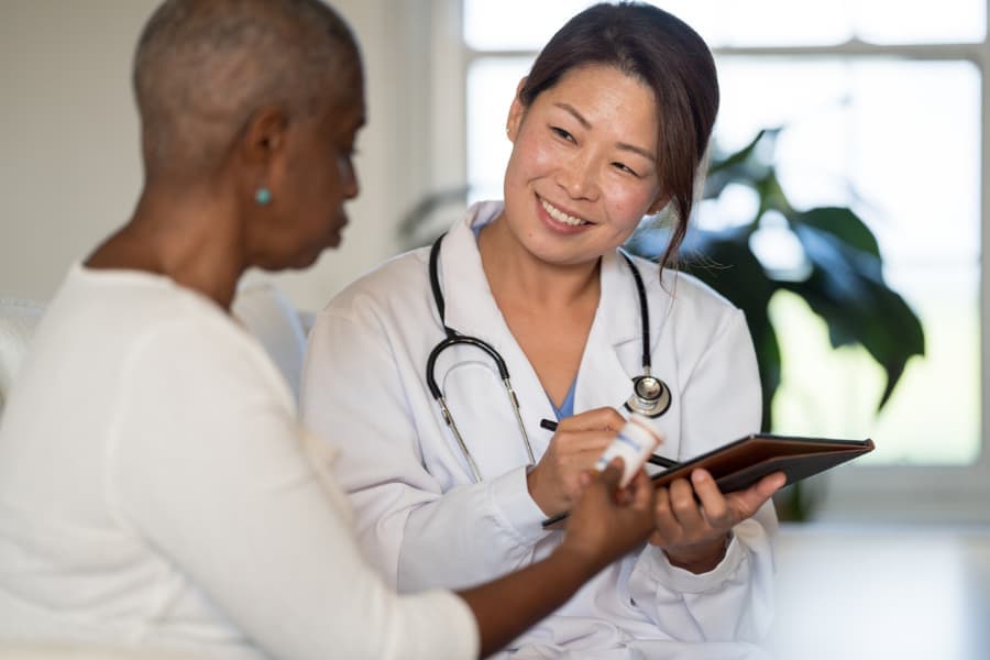 Physician discussing treatment options with cancer patient