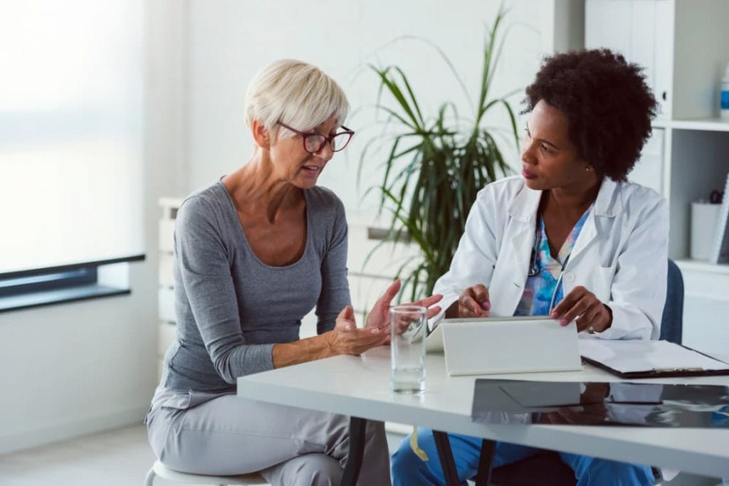 Patient And Physician Discuss Palliative Care