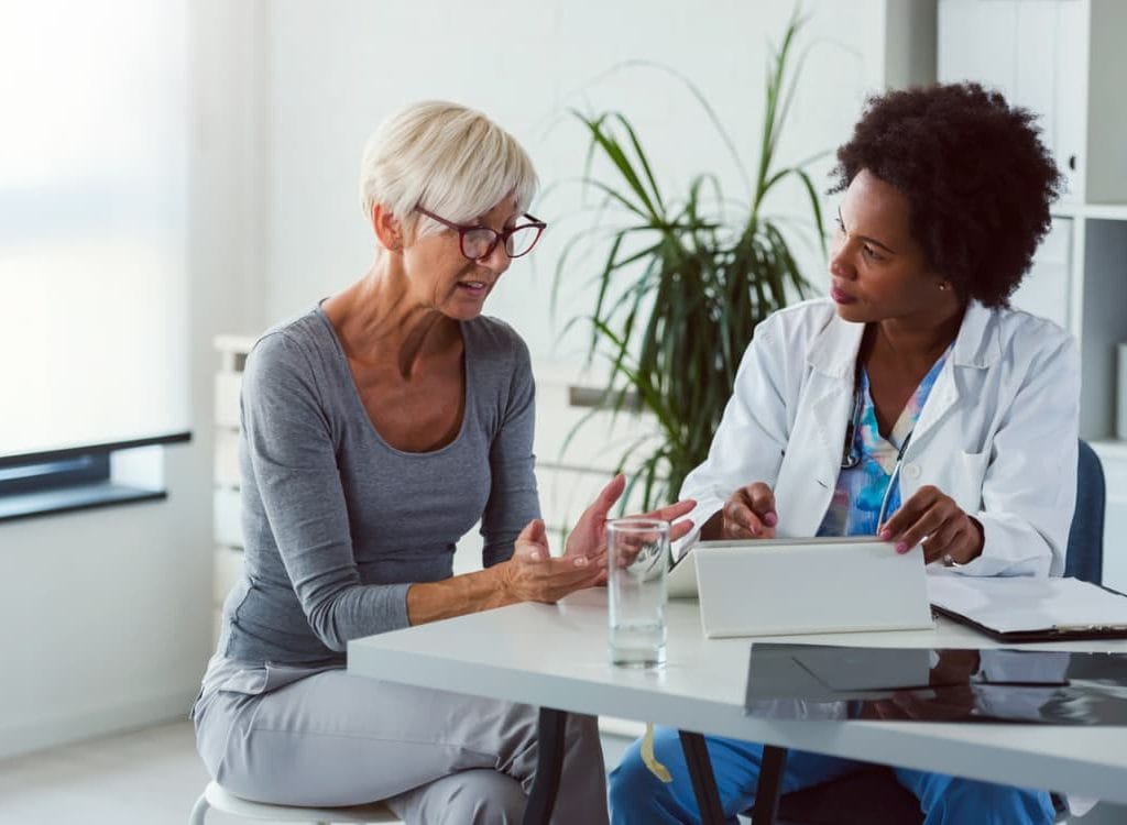 Patient And Physician Discuss Palliative Care