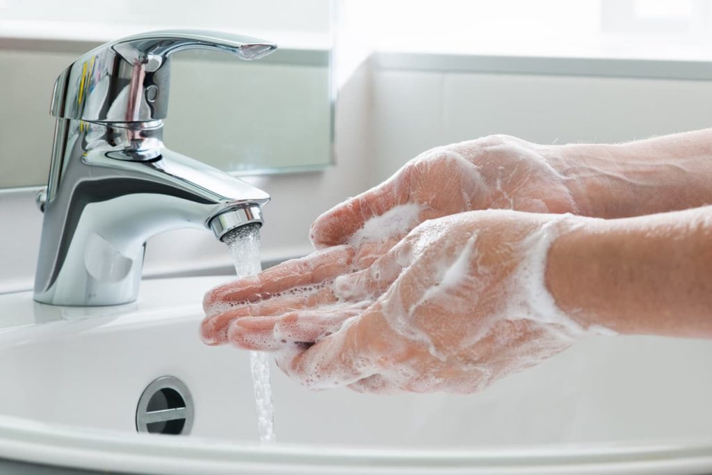 Soapy Hands Being Washed