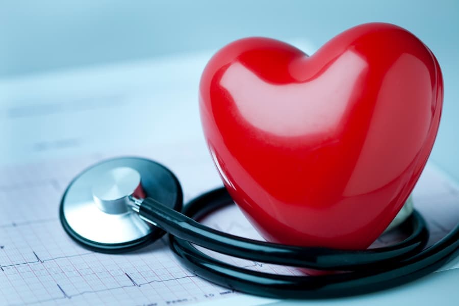 Heart shape on an electrocardiogram readout, with a stethoscope